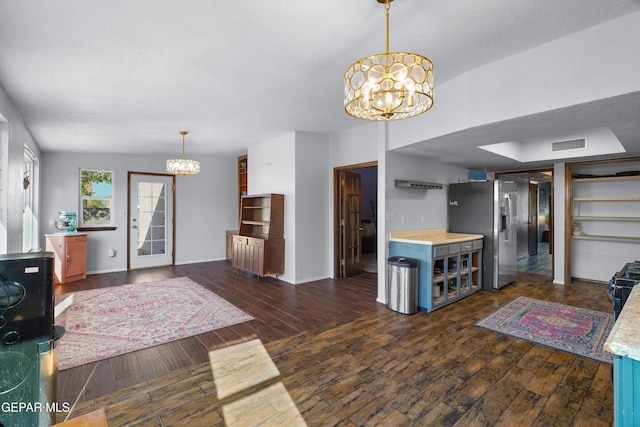 6604 Camino Fuente Dr, El Paso, TX 79912 - living room featuring a chandelier and dark wood-style flooring