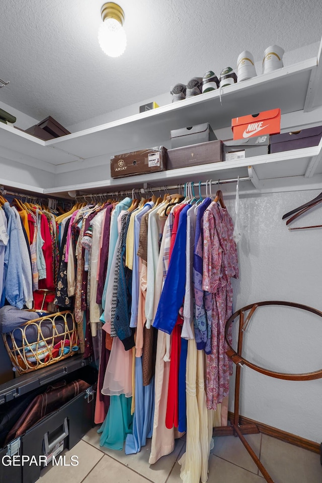6604 Camino Fuente Dr, El Paso, TX 79912 - spacious closet with tile patterned flooring