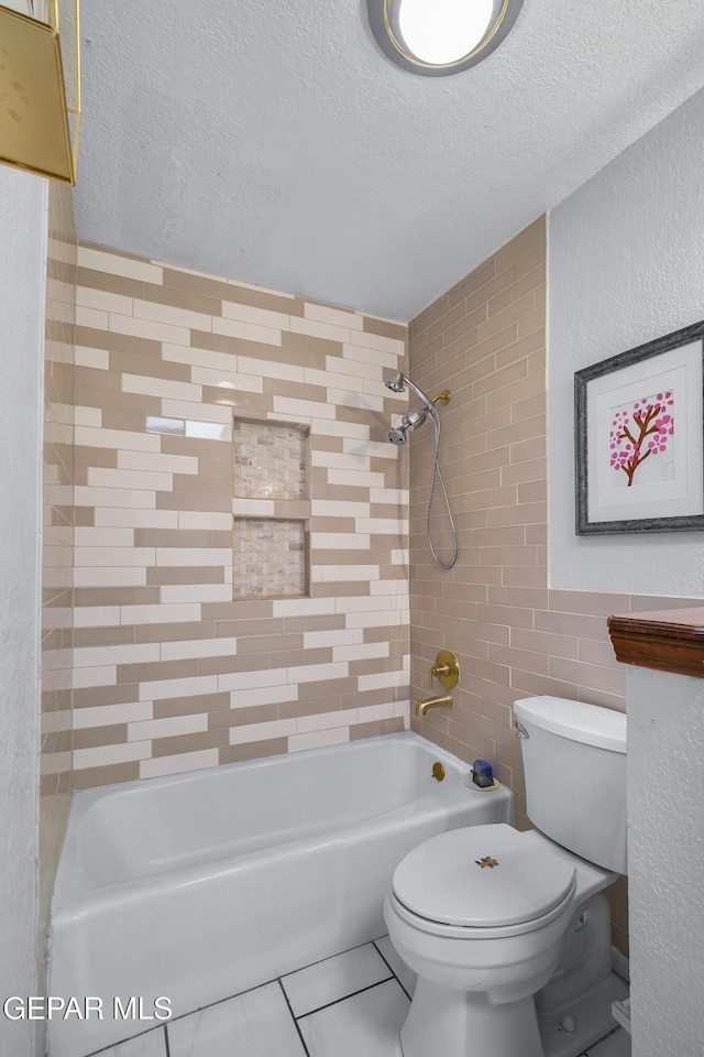 6604 Camino Fuente Dr, El Paso, TX 79912 - full bath with a textured ceiling, bathing tub / shower combination, tile walls, and tile patterned flooring