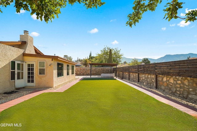 6604 Camino Fuente Dr, El Paso, TX 79912 - fenced backyard featuring a mountain view and a patio area
