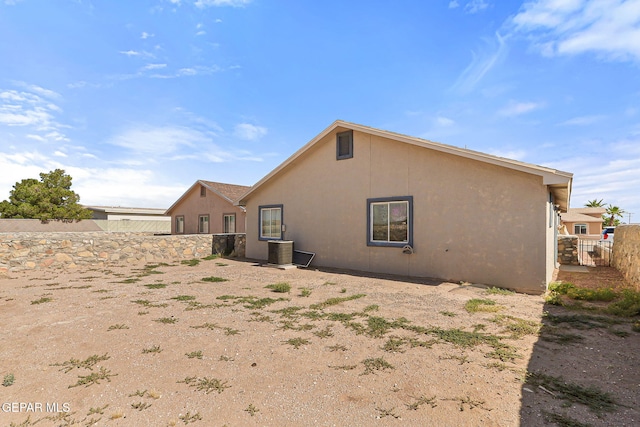 13344 Jonathan Elias Ct, El Paso, TX 79938 - back of property featuring a fenced backyard and stucco siding