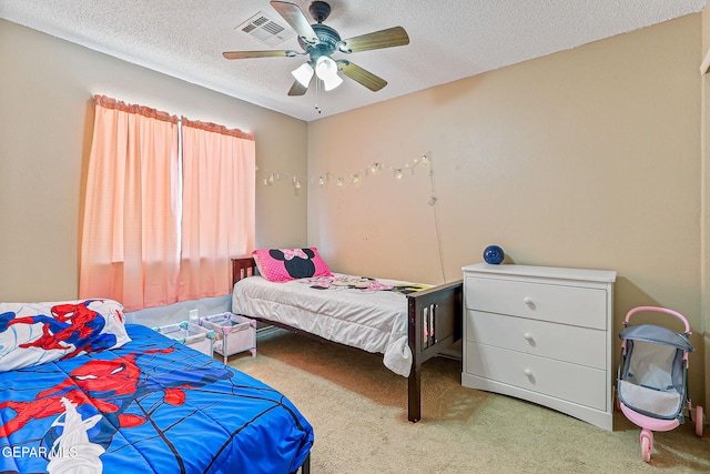 13344 Jonathan Elias Ct, El Paso, TX 79938 - carpeted bedroom featuring a textured ceiling and a ceiling fan