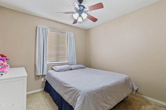 13344 Jonathan Elias Ct, El Paso, TX 79938 - bedroom with light colored carpet and ceiling fan