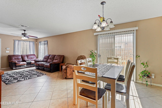 13344 Jonathan Elias Ct, El Paso, TX 79938 - dining area with a chandelier, light tile patterned floors, a textured ceiling, and ceiling fan