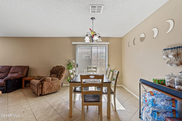 13344 Jonathan Elias Ct, El Paso, TX 79938 - dining space featuring a chandelier, light tile patterned floors, and a textured ceiling