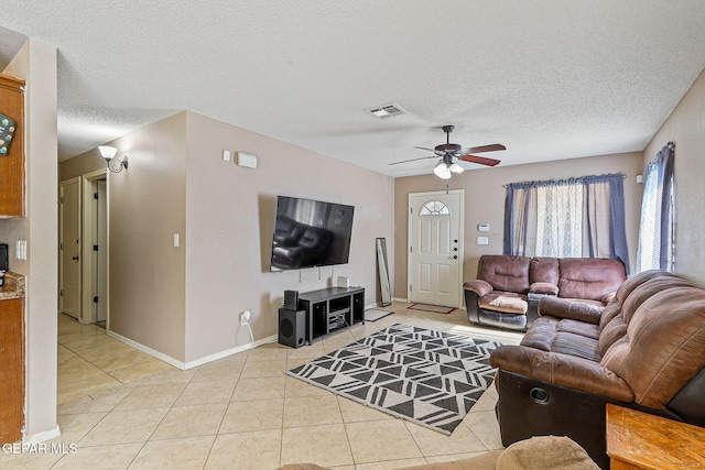 13344 Jonathan Elias Ct, El Paso, TX 79938 - living area with light tile patterned flooring, ceiling fan, and a textured ceiling