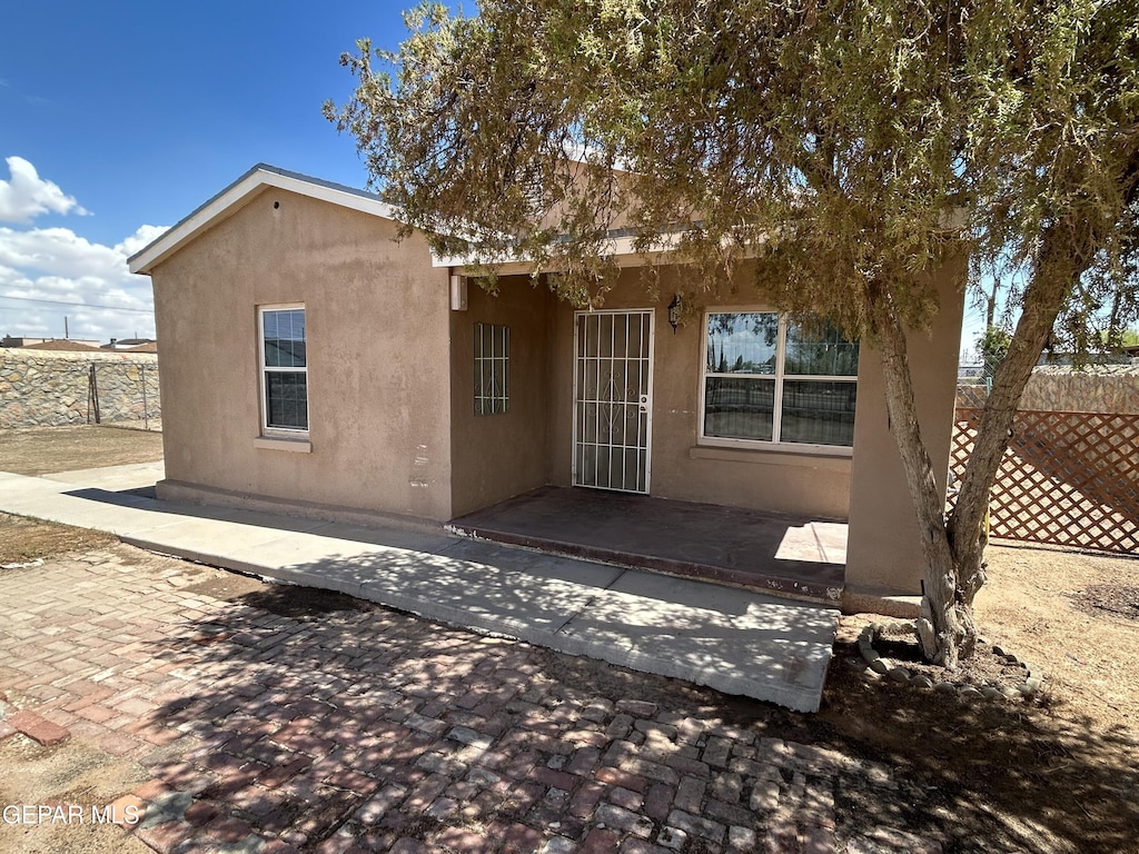 4734 Titanic Ave, El Paso, TX 79904 - rear view of house with stucco siding and a patio area