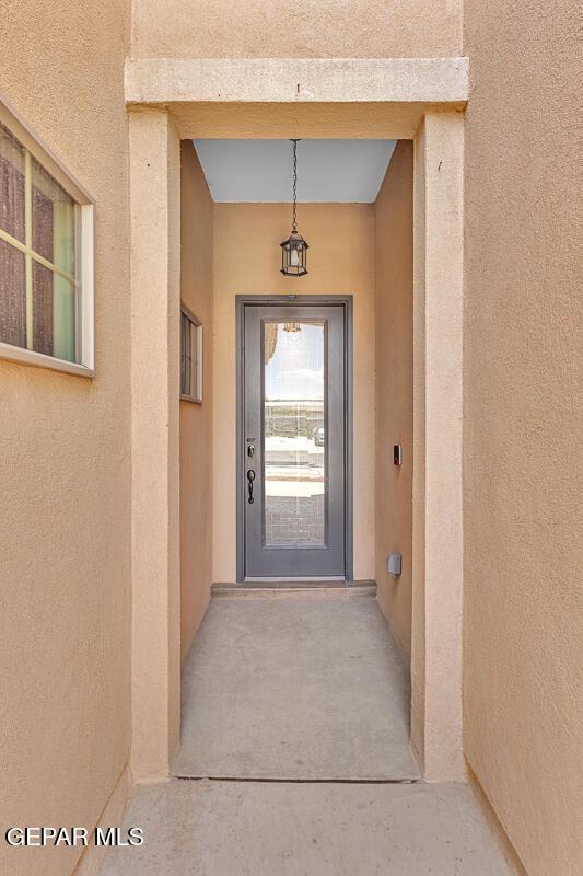 991 Hull St, El Paso, TX 79928 - entrance to property featuring stucco siding