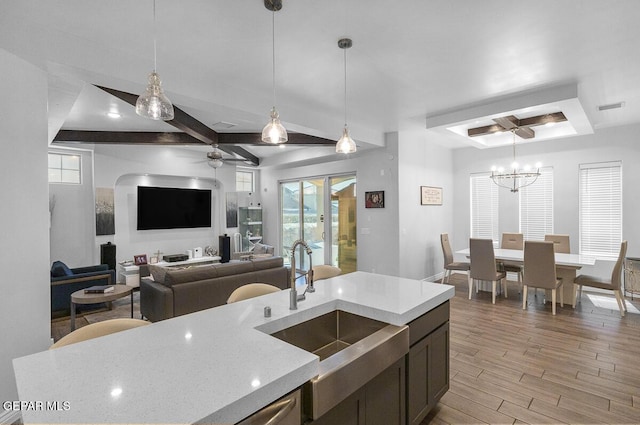 991 Hull St, El Paso, TX 79928 - kitchen featuring a tray ceiling, light wood-type flooring, hanging light fixtures, ceiling fan, and beam ceiling