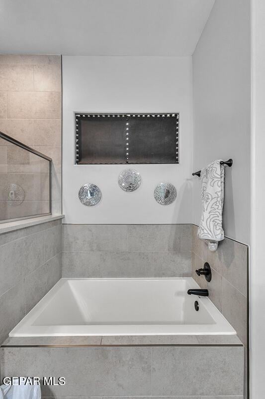 991 Hull St, El Paso, TX 79928 - bathroom with a tub to relax in and a tile shower