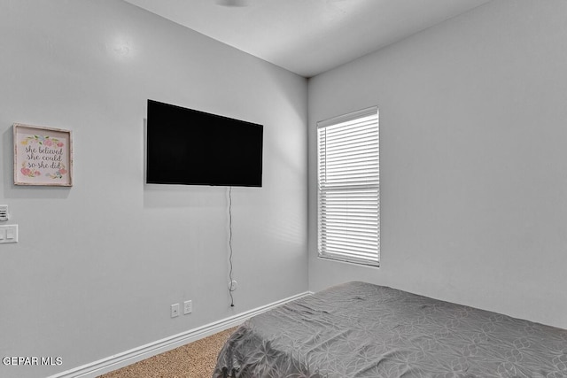 991 Hull St, El Paso, TX 79928 - carpeted bedroom featuring baseboards