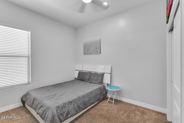 991 Hull St, El Paso, TX 79928 - carpeted bedroom featuring multiple windows and a ceiling fan