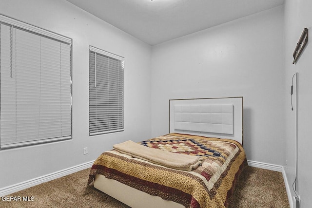 991 Hull St, El Paso, TX 79928 - carpeted bedroom featuring baseboards