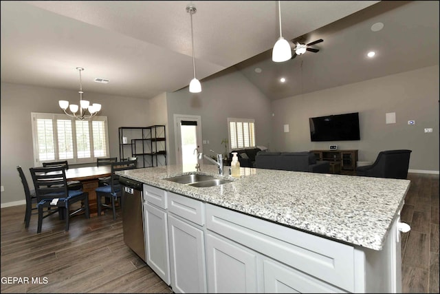 929 Pecos River Dr, El Paso, TX 79932 - kitchen featuring white cabinets, a chandelier, dark wood finished floors, vaulted ceiling, and an island with sink