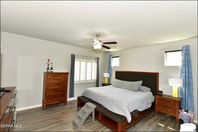 929 Pecos River Dr, El Paso, TX 79932 - bedroom with wood finished floors, multiple windows, and a ceiling fan