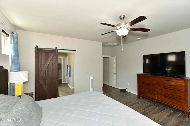 929 Pecos River Dr, El Paso, TX 79932 - bedroom with wood finished floors, a barn door, and a ceiling fan