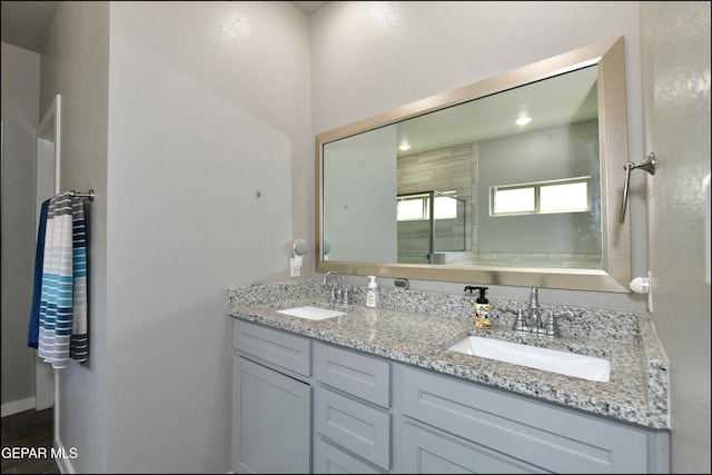 929 Pecos River Dr, El Paso, TX 79932 - full bathroom with double vanity and a shower stall