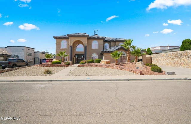 12247 Chisholm Pass Dr, El Paso, TX 79936 - mediterranean / spanish home featuring a tiled roof and stucco siding