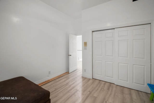 12247 Chisholm Pass Dr, El Paso, TX 79936 - unfurnished bedroom with light wood finished floors and a closet