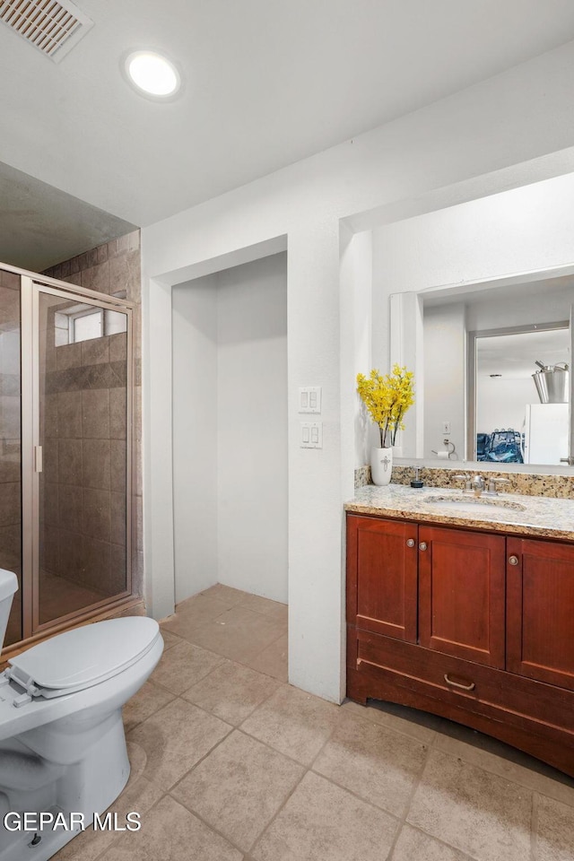 12247 Chisholm Pass Dr, El Paso, TX 79936 - full bath featuring vanity, a shower stall, and tile patterned floors