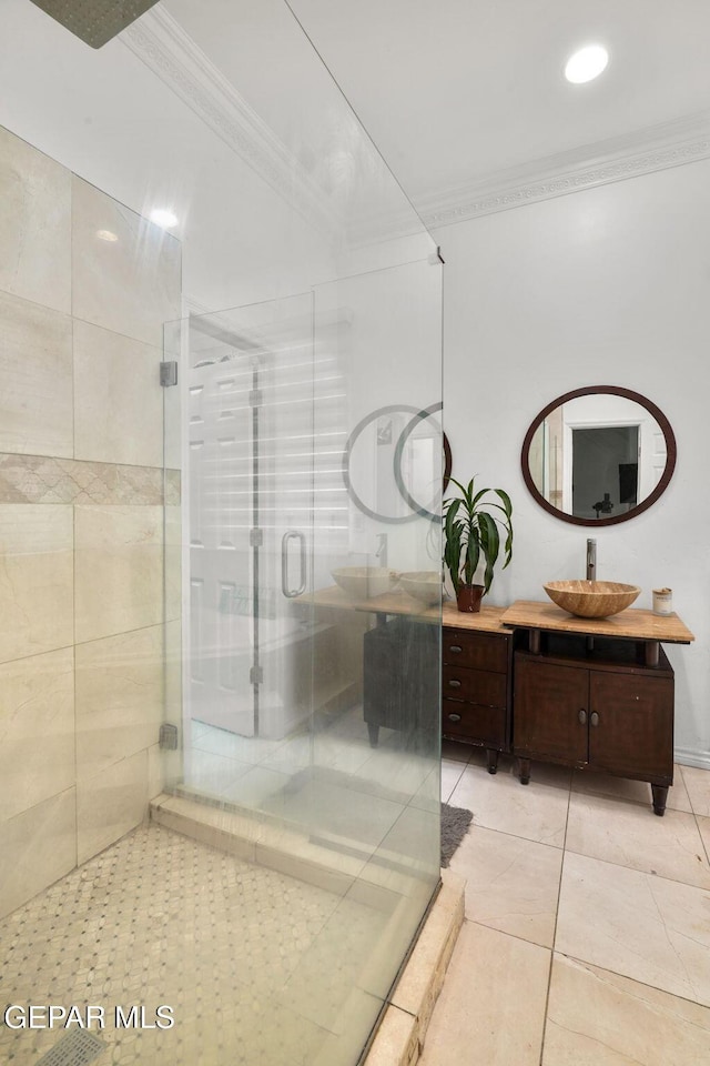 12247 Chisholm Pass Dr, El Paso, TX 79936 - bathroom featuring ornamental molding, a shower stall, vanity, tile patterned flooring, and recessed lighting