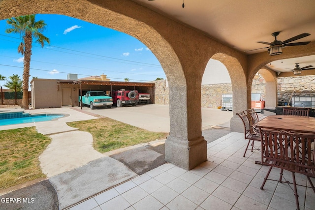 12247 Chisholm Pass Dr, El Paso, TX 79936 - view of patio / terrace with a ceiling fan, an outdoor pool, and outdoor dining space