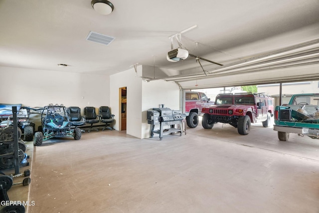 12247 Chisholm Pass Dr, El Paso, TX 79936 - garage featuring a garage door opener