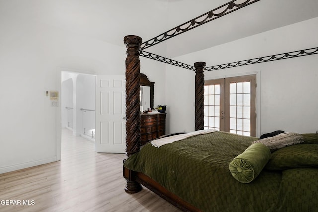 12247 Chisholm Pass Dr, El Paso, TX 79936 - bedroom with light wood-type flooring and french doors