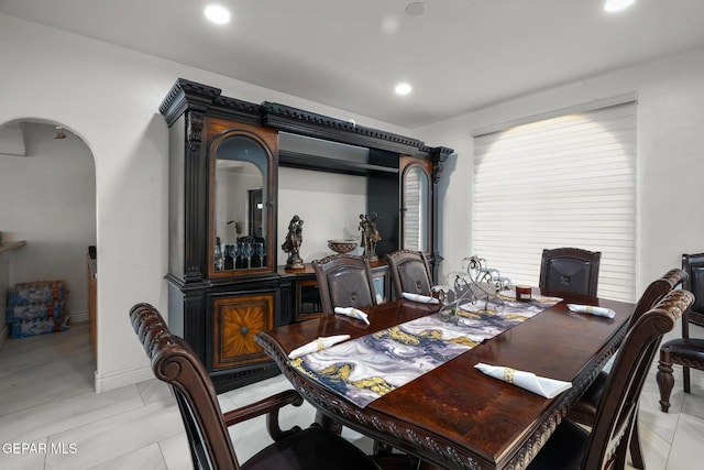 12247 Chisholm Pass Dr, El Paso, TX 79936 - dining space with arched walkways and recessed lighting