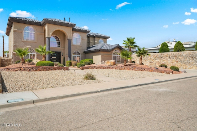 12247 Chisholm Pass Dr, El Paso, TX 79936 - mediterranean / spanish home featuring stucco siding and a tiled roof
