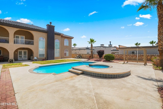 12247 Chisholm Pass Dr, El Paso, TX 79936 - view of pool featuring french doors, a patio area, and a pool with connected hot tub