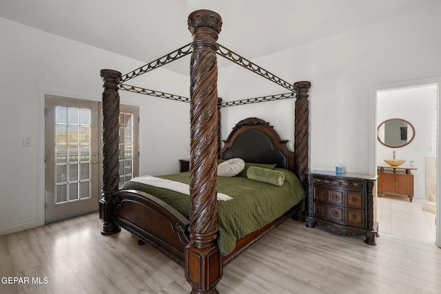 12247 Chisholm Pass Dr, El Paso, TX 79936 - bedroom featuring light wood finished floors and access to exterior