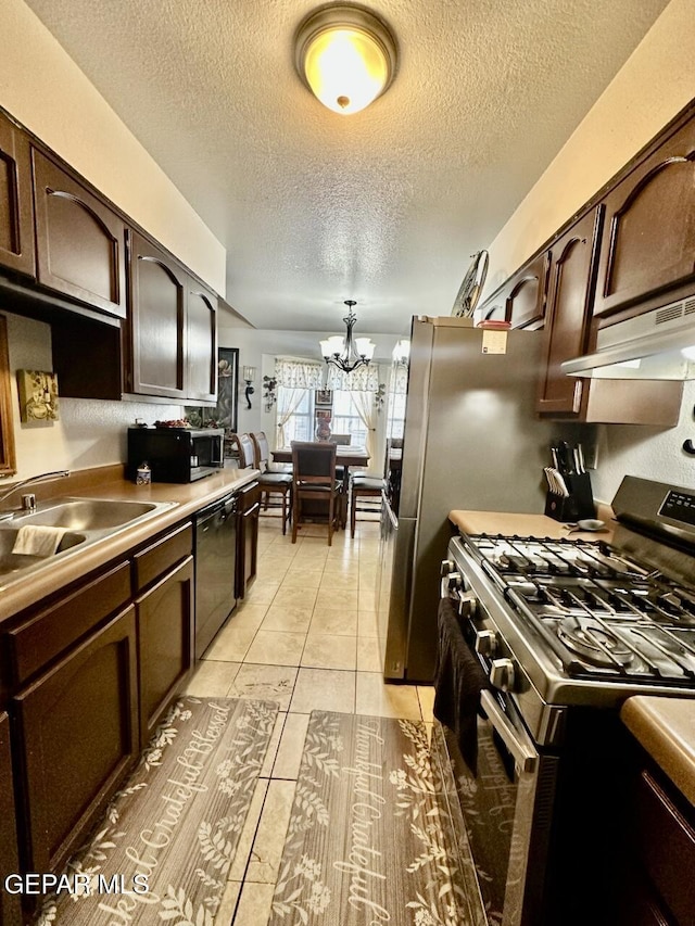 12036 Valley Quail Dr, El Paso, TX 79936 - kitchen featuring stainless steel range with gas cooktop, dishwasher, a textured ceiling, under cabinet range hood, and a chandelier
