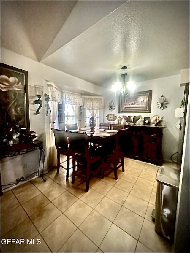 12036 Valley Quail Dr, El Paso, TX 79936 - tiled dining space featuring a textured ceiling and a chandelier