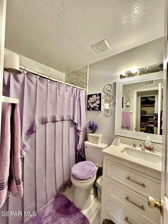 12036 Valley Quail Dr, El Paso, TX 79936 - full bathroom featuring vanity, a textured wall, a textured ceiling, and a shower with shower curtain