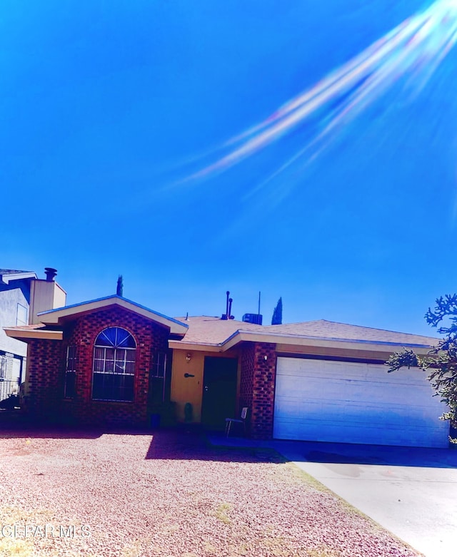 12036 Valley Quail Dr, El Paso, TX 79936 - single story home with concrete driveway, a garage, and brick siding