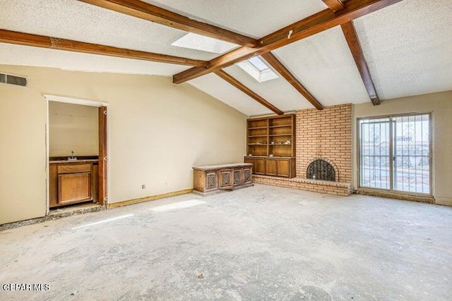 1944 Ratner Cir, El Paso, TX 79936 - unfurnished living room with a brick fireplace and built in features