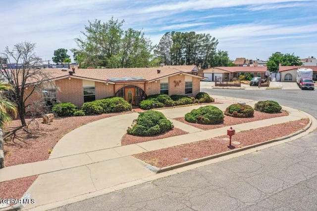 1944 Ratner Cir, El Paso, TX 79936 - ranch-style house with curved driveway and brick siding