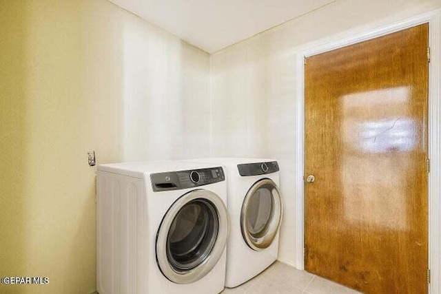 1944 Ratner Cir, El Paso, TX 79936 - laundry area featuring separate washer and dryer and light tile patterned floors