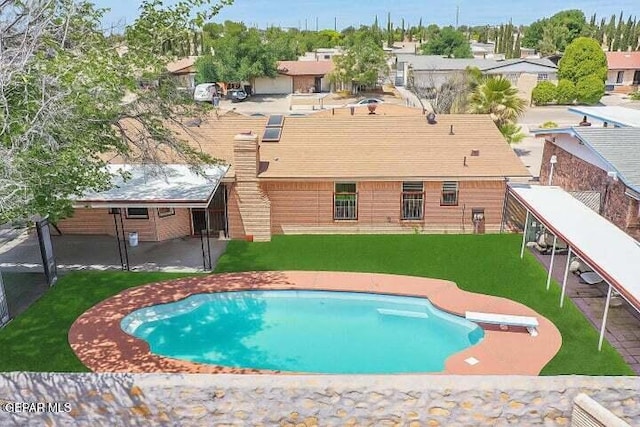 1944 Ratner Cir, El Paso, TX 79936 - swimming pool with a diving board and a lawn
