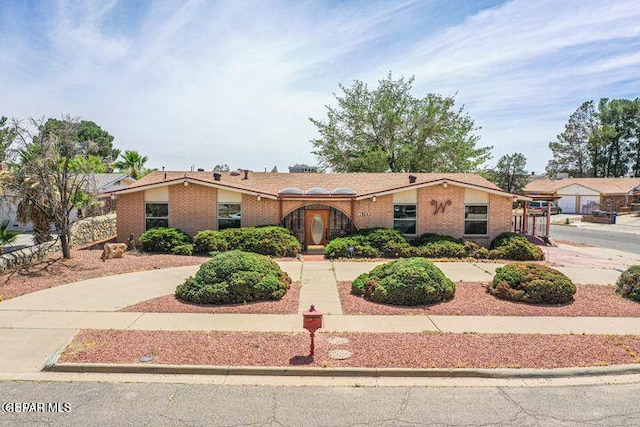 1944 Ratner Cir, El Paso, TX 79936 - ranch-style house with brick siding and curved driveway