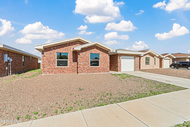 708 Cora Ruecker, El Paso, TX 79928 - ranch-style home featuring concrete driveway, brick siding, and a garage