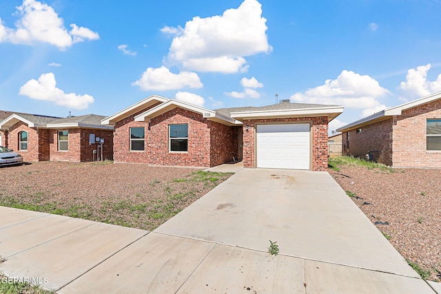 708 Cora Ruecker, El Paso, TX 79928 - single story home with an attached garage, driveway, and brick siding