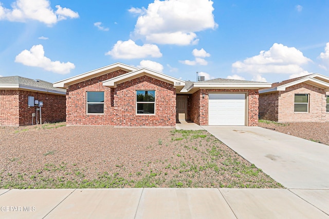 708 Cora Ruecker, El Paso, TX 79928 - ranch-style home featuring driveway, a garage, and brick siding