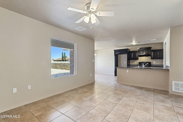 708 Cora Ruecker, El Paso, TX 79928 - unfurnished living room featuring light tile patterned flooring and a ceiling fan