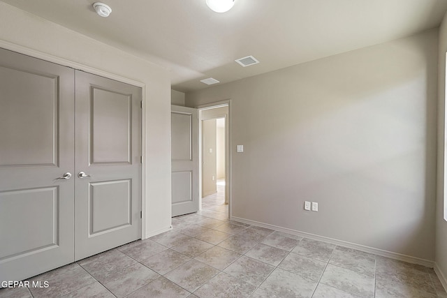 708 Cora Ruecker, El Paso, TX 79928 - unfurnished bedroom featuring a closet and light tile patterned floors