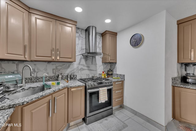 11749 Socorro Rd, Socorro, TX 79927 - kitchen featuring gas stove, wall chimney range hood, light stone counters, tasteful backsplash, and light tile patterned floors