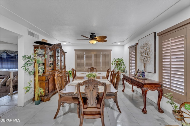 11749 Socorro Rd, Socorro, TX 79927 - dining room featuring ceiling fan, a textured ceiling, and light tile patterned floors
