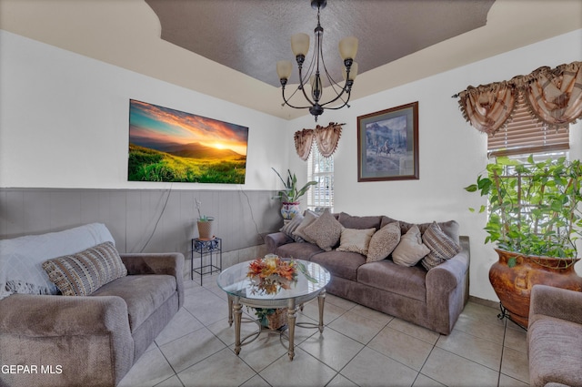 11749 Socorro Rd, Socorro, TX 79927 - living room featuring a chandelier, light tile patterned flooring, and a textured ceiling