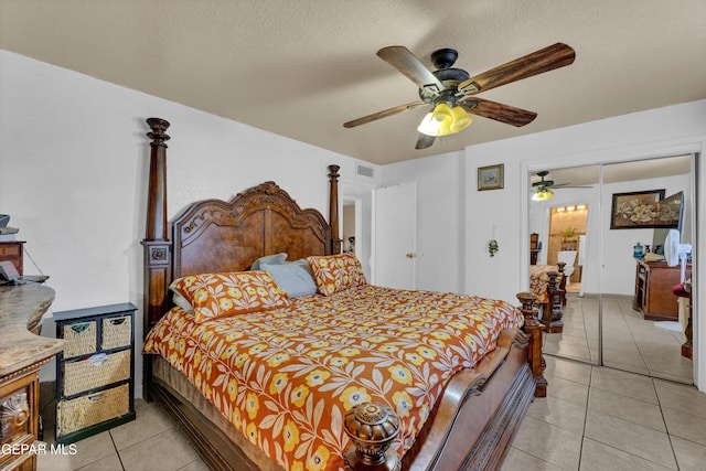 11749 Socorro Rd, Socorro, TX 79927 - bedroom featuring light tile patterned floors, ceiling fan, and a textured ceiling